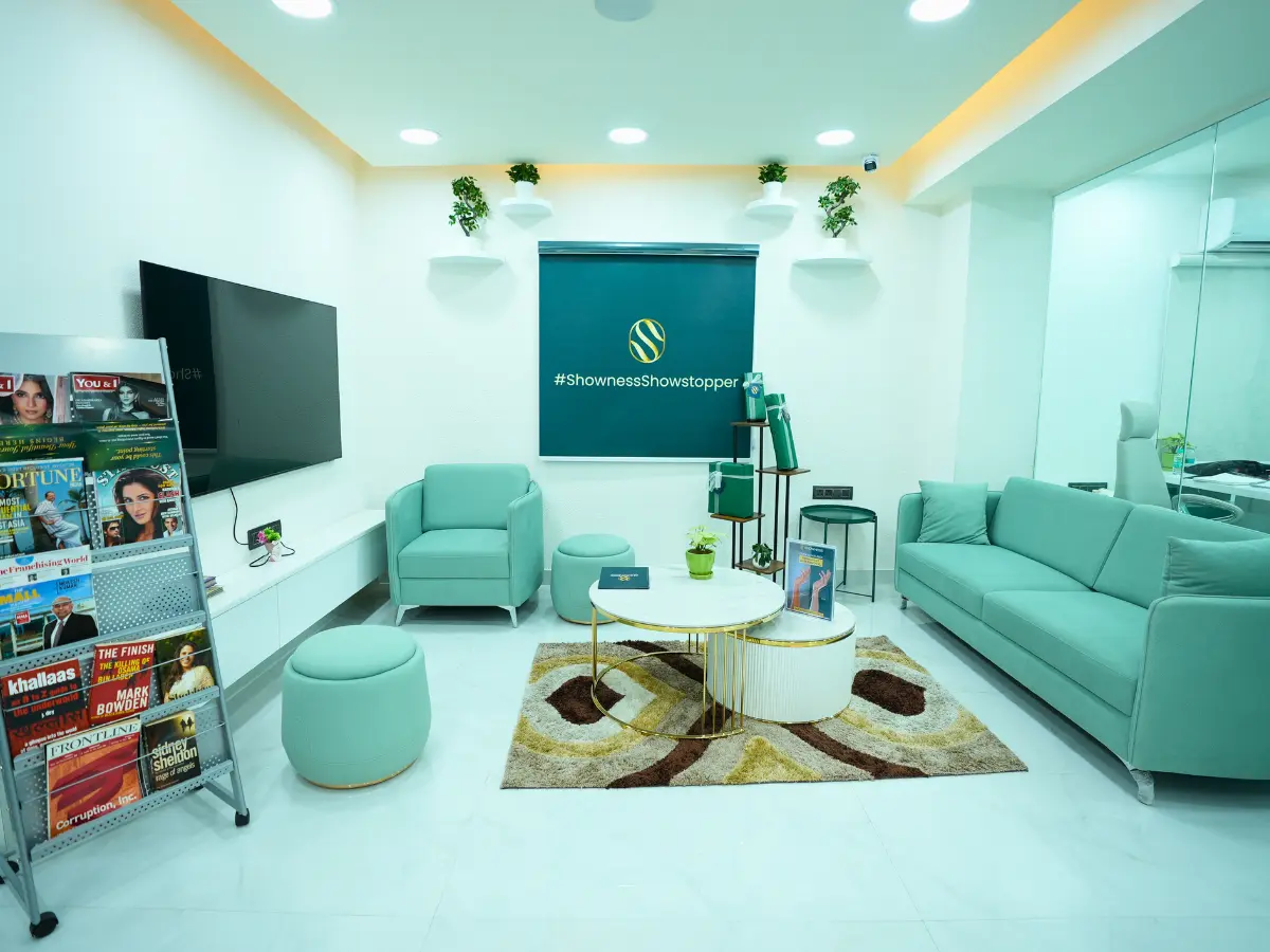 Showness clinic waiting lounge in Hyderabad with branded backdrop