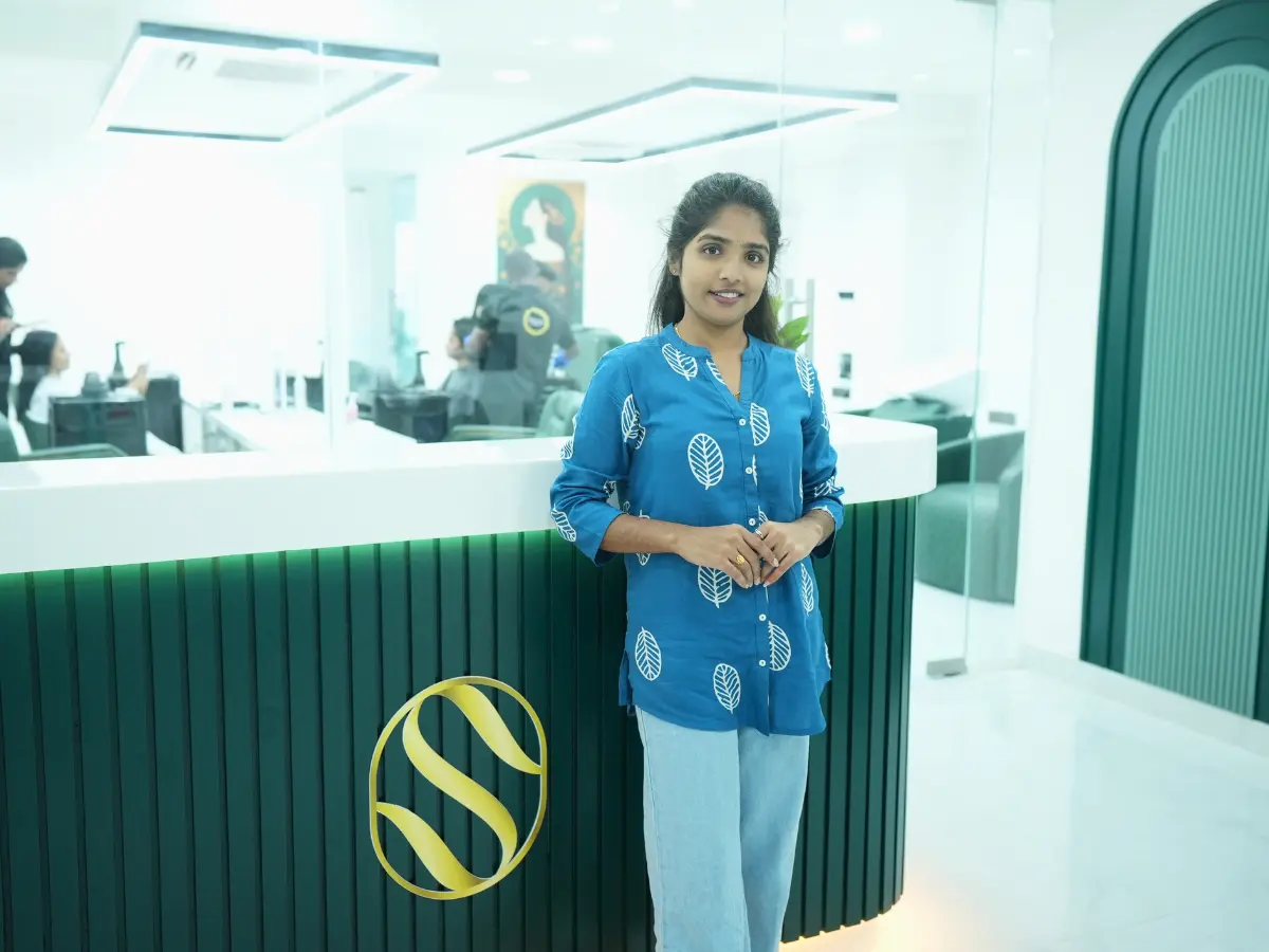 Showness clinic reception desk with gold monogram, Hyderabad